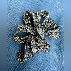 Silver brooch with sparkling stones